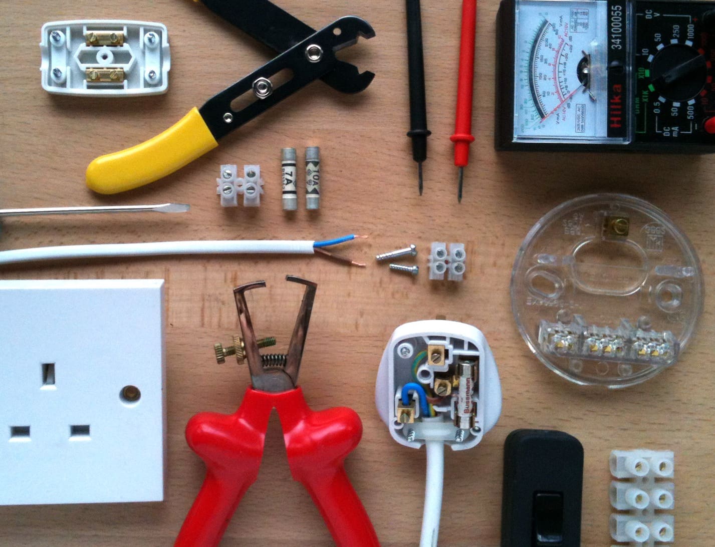 UK electrical tools, plug wiring, fuses and test meter — qualified electricians at Kings Renovations in Hertfordshire